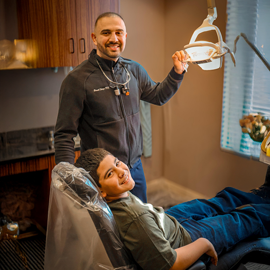 Dr. Ishaya and young patient smiling